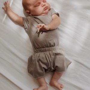 A baby Brand romper | Woolskins